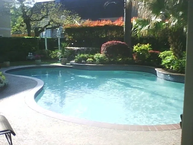 07 Image of a beautifully renovated swimming pool, with text overlay featuring "Clear Choice Pool Care." The image highlights "Pool Remodel - After," showcasing the stunning transformation and modern updates made to the pool.
