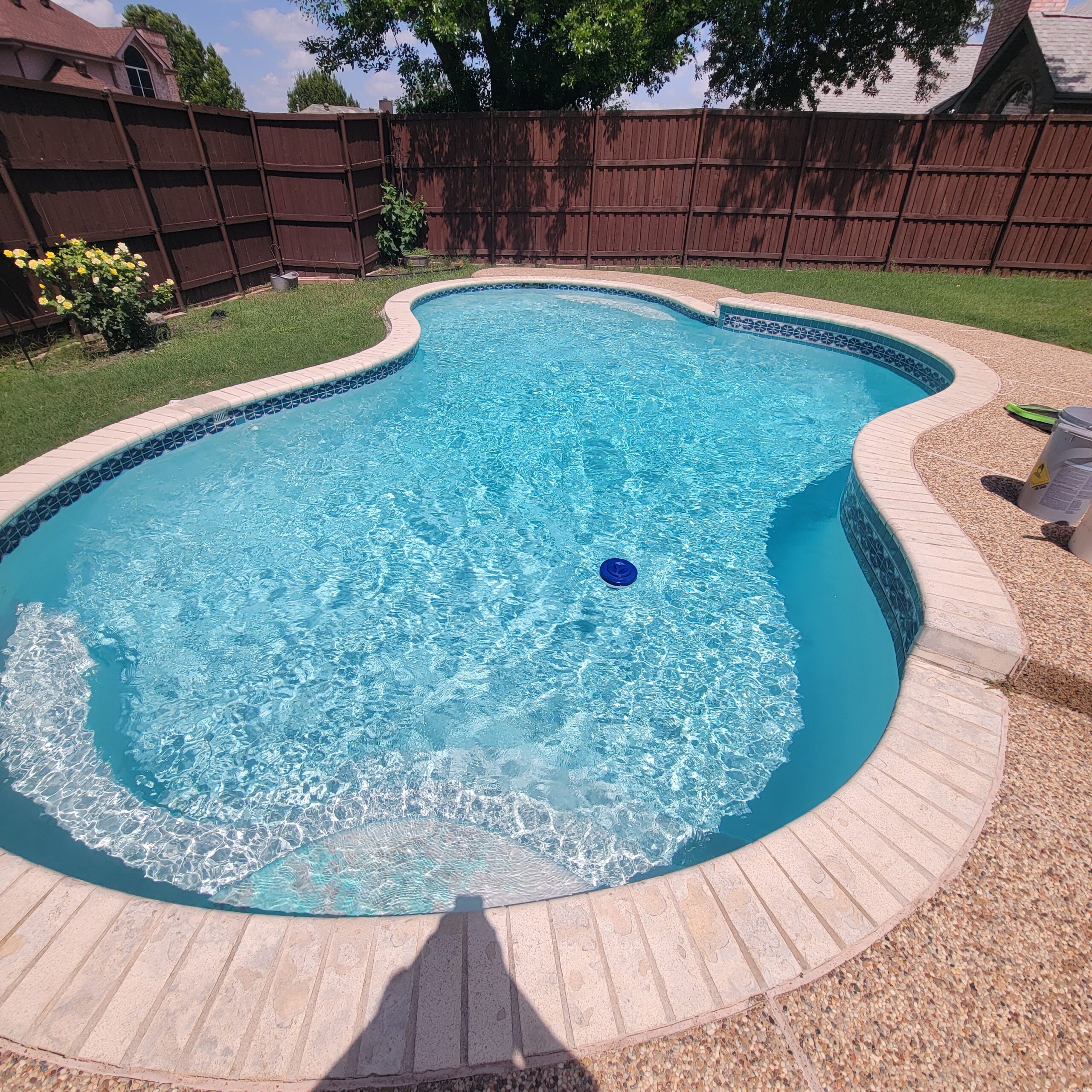 2306152035 Image of a beautifully renovated swimming pool, with text overlay featuring "Clear Choice Pool Care." The image highlights "Pool Remodel - After," showcasing the stunning transformation and modern updates made to the pool.